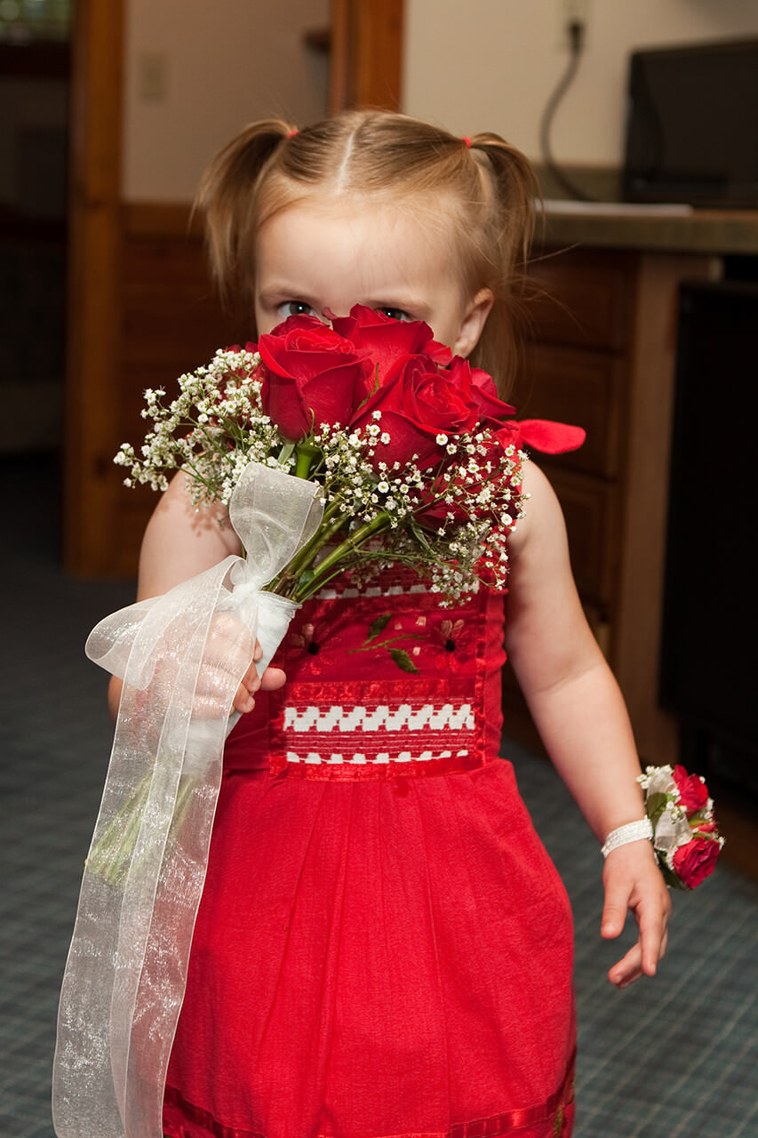 Flower girl with red roses