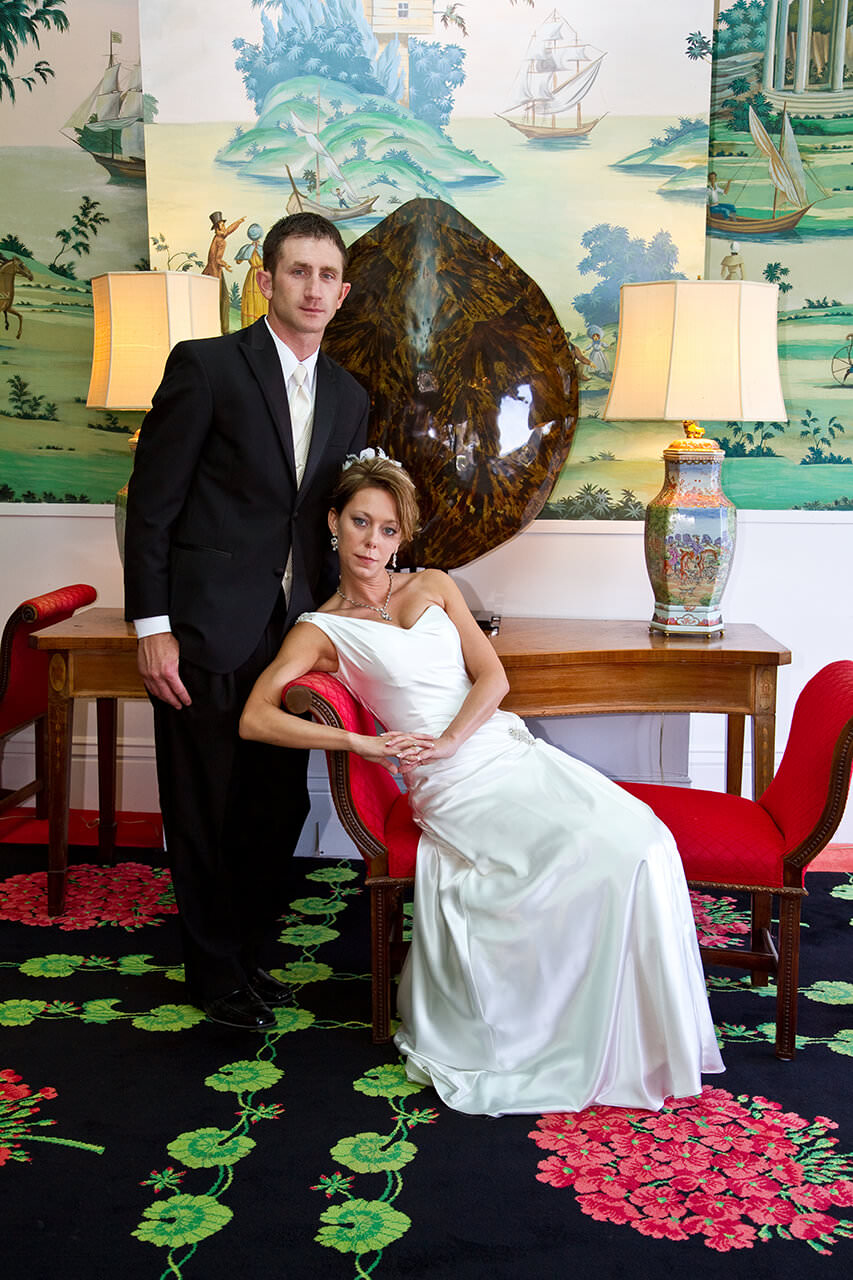 Bride and groom posing at the Grand Hotel lobby.