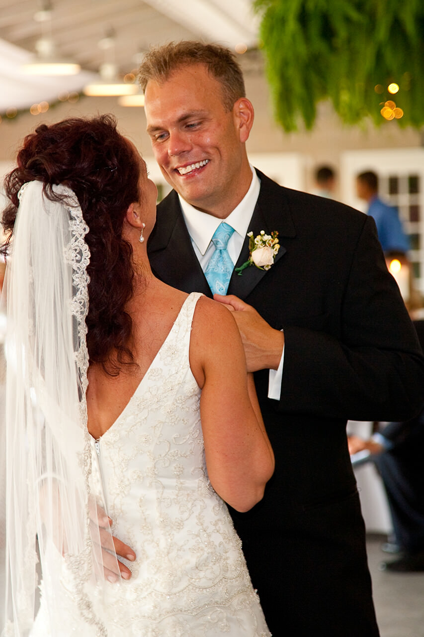 Groom smiling at his bride